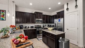 Coffee/tea maker, fridge, microwave, oven