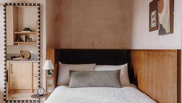 Premium bedding, pillowtop beds, laptop workspace, blackout drapes