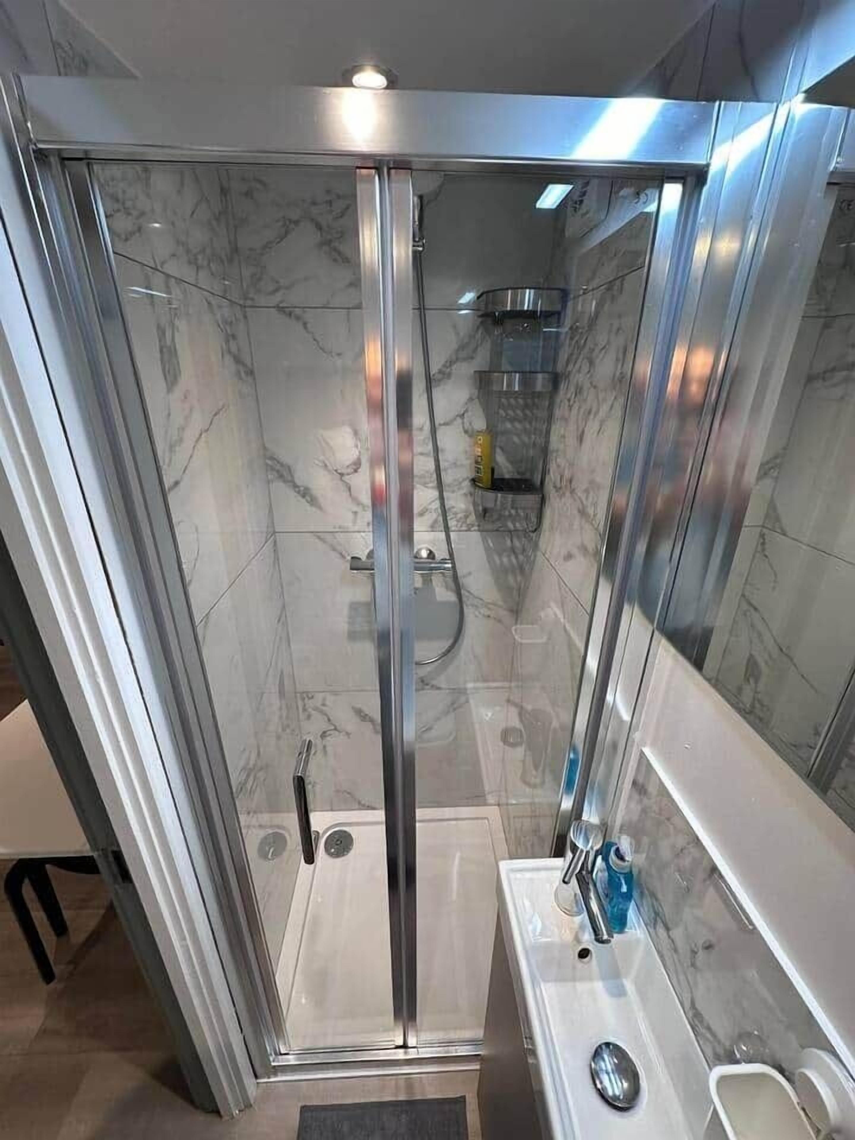 Shower, hair dryer, towels, soap