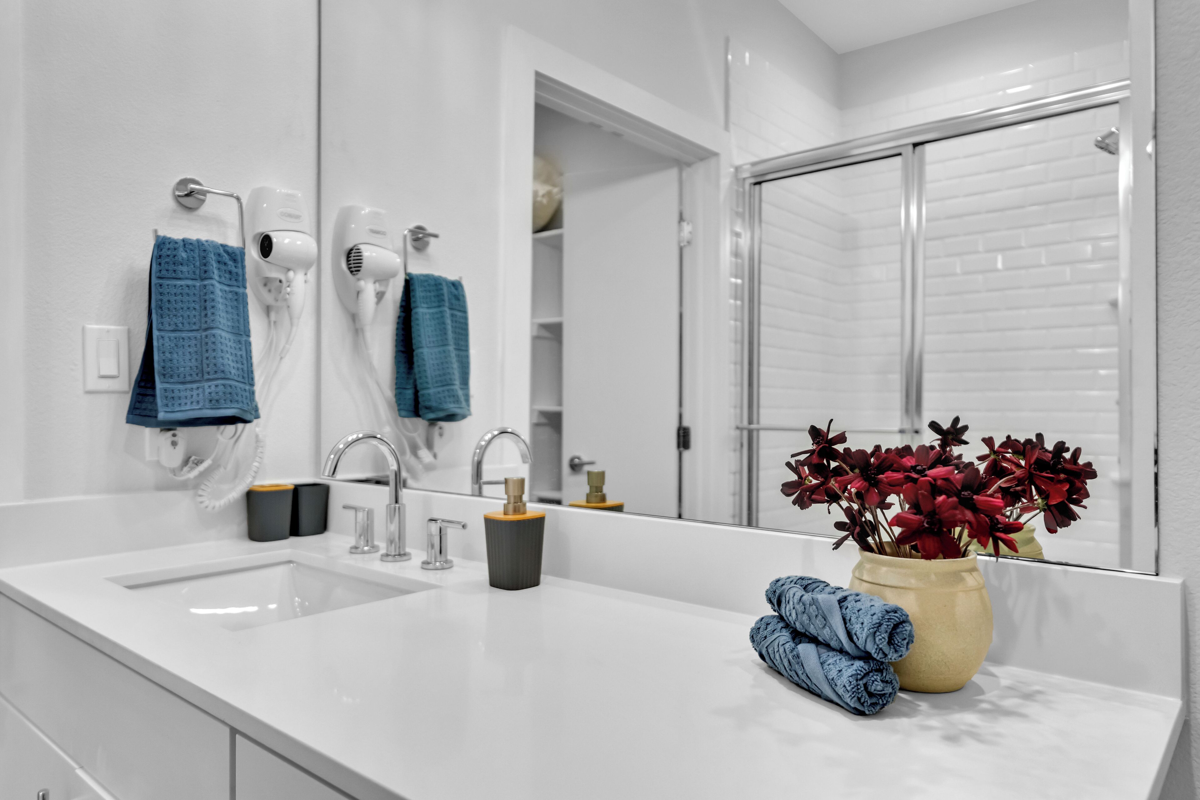 Shower, hair dryer, towels, toilet paper