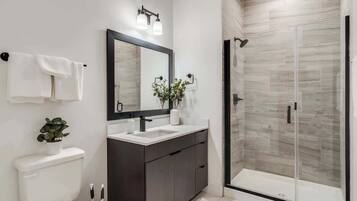 Shower, hair dryer, towels, shampoo