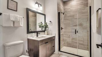Shower, hair dryer, towels, shampoo