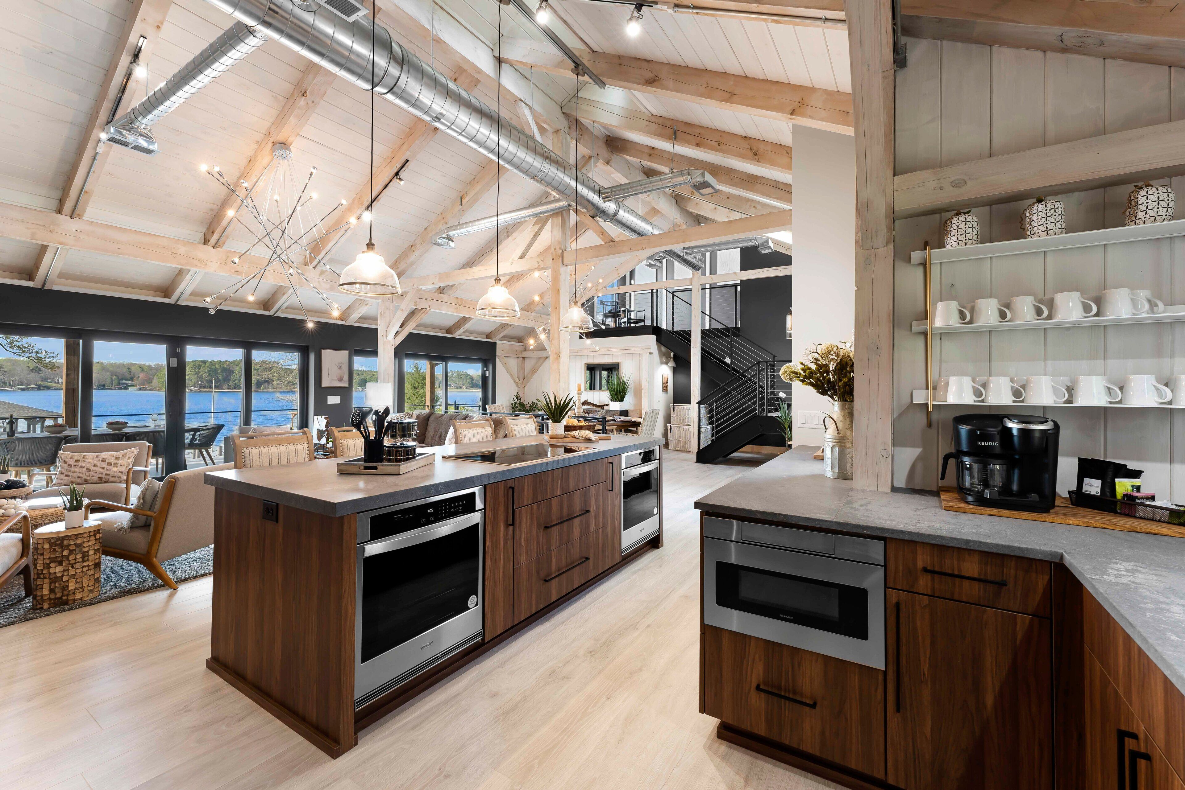 A spacious kitchen with wooden cabinets, stainless steel appliances, and a large island.