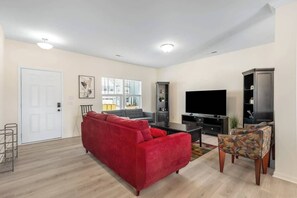 Exclusive House, Garden View | Living area | 50-inch Smart TV with cable channels, Netflix, Hulu - Modern Comfort Spacious Home 5BR 3BA  (Greensboro)