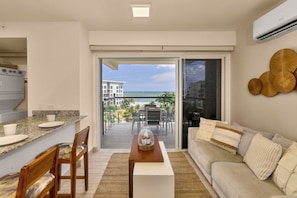 Deluxe Apartment, Balcony, Sea View | Living area