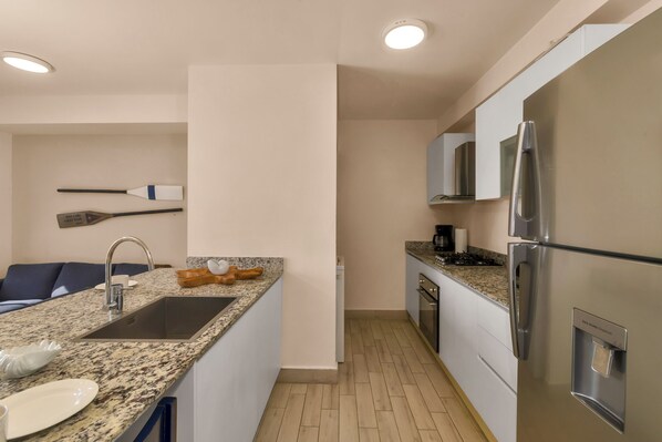 Deluxe Apartment, Balcony, Sea View | Private kitchen | Fridge, microwave, oven, cookware/dishes/utensils - Ventanas del Mar by Playa Caracol Resort (Punta Chame)