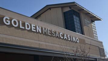 The exterior of the Golden Mesaca Casino with its name prominently displayed on the facade.