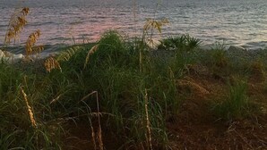 A coastal landscape with a view of the sea and sky during sunset. - 139 High Hammock (Seabrook Island)