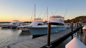 A marina with several yachts docked at wooden piers. - 126 High Hammock (Seabrook Island)