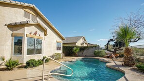 A residential property with a swimming pool, a covered patio, and a landscaped garden. - 120th Avondale (Avondale)
