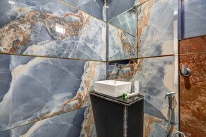 Shower, free toiletries, slippers, towels