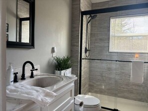 Shower, hair dryer, towels, soap
