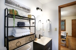 Shower, hair dryer, towels, soap