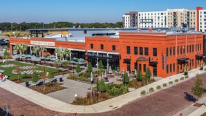 A red brick building with a sign for 'Tampa Armature Works' and 'Lights Public Market'. - 2215 E 19th Ave (Tampa)