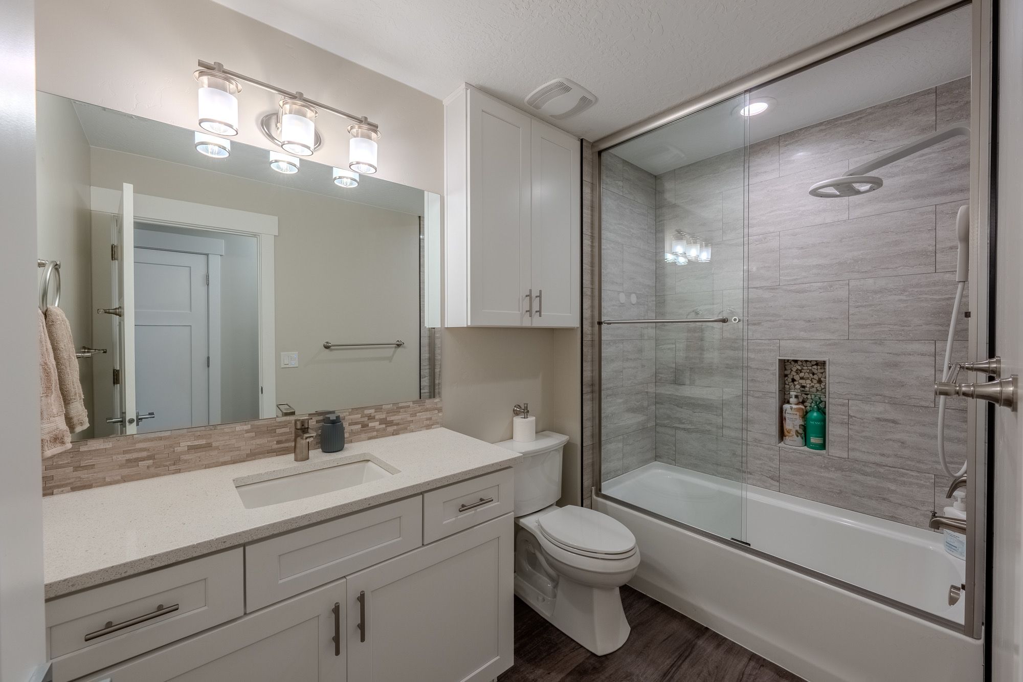 Bathroom with a tub and shower