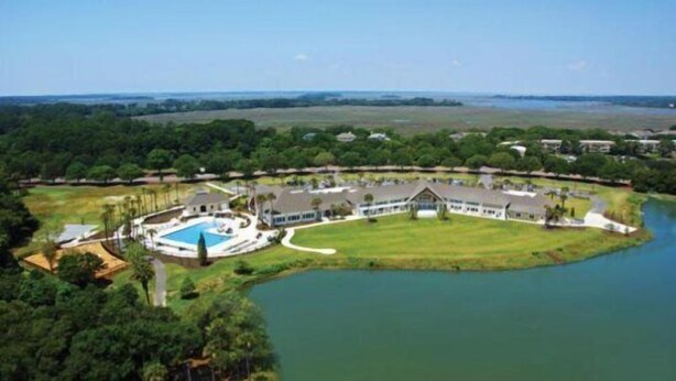 A large resort with a central building, a swimming pool, and a lake. - 601 Double Eagle Trace (Seabrook Island)
