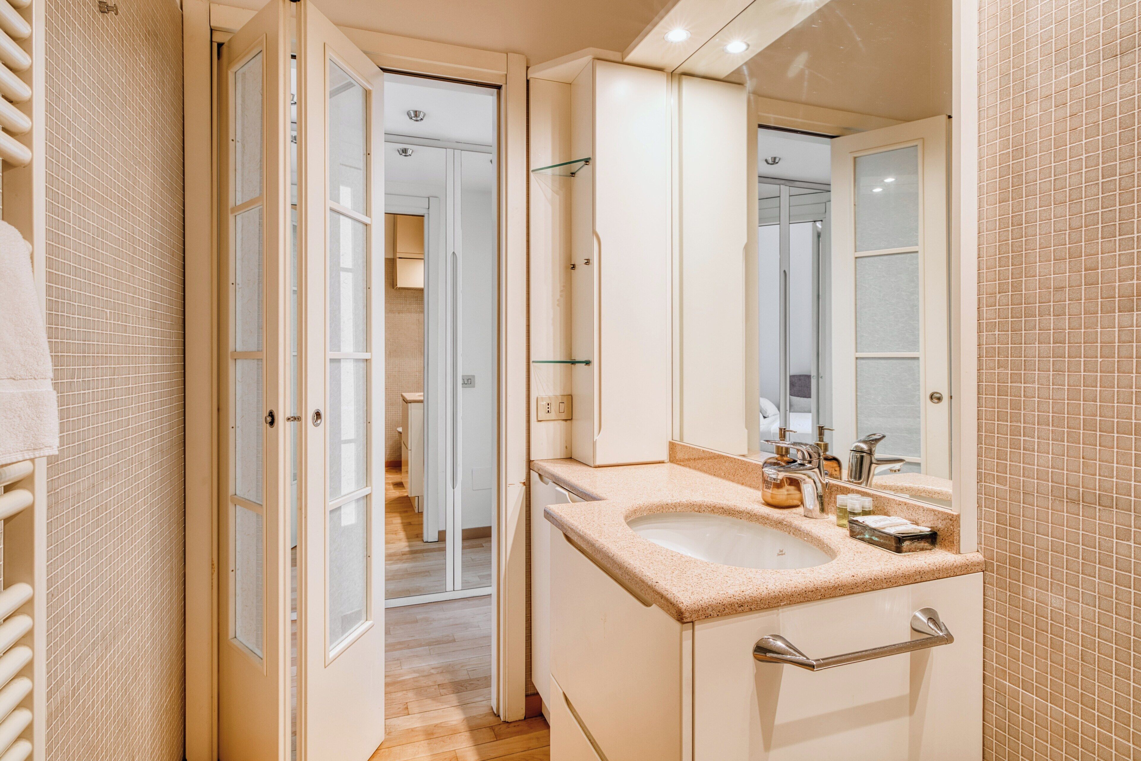 Apartment, 1 Queen Bed | Bathroom | Shower, towels, soap, shampoo