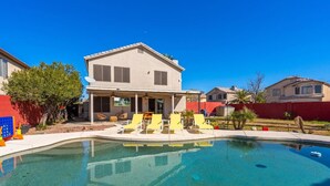 A house with a swimming pool, yellow lounge chairs, and a covered patio area. - Glendale w Pool & Games (Glendale)