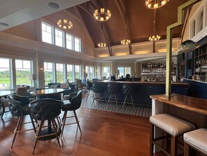 A spacious bar area with high ceilings and large windows. - Three Bedroom By Beach and Club Free Amenity Card 1827 (Seabrook Island)