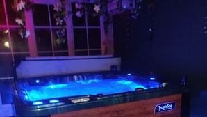 A hot tub with a wooden exterior and a label reading "TropicSpa." - Beautiful, 1h to Paris, 8-bedroom country house in soothing Normandie (Évreux)