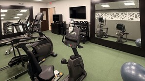 A gym with treadmills, elliptical machines, and a mirrored wall. - Sleep Inn - Oklahoma City Airport (Oklahoma City)
