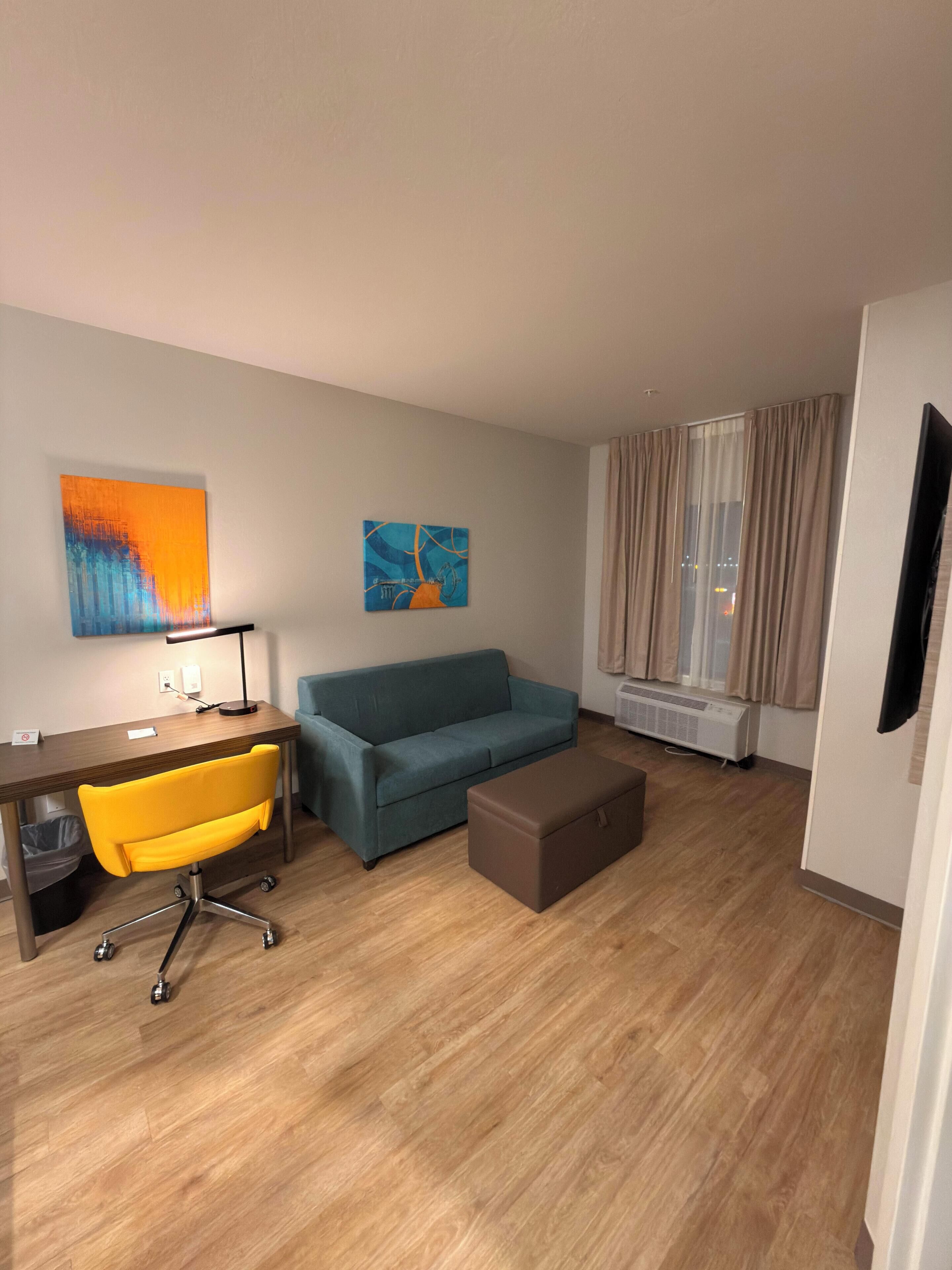 Room, 1 King Bed, Non Smoking (Efficiency) | Living area | 55-inch LED TV with cable channels