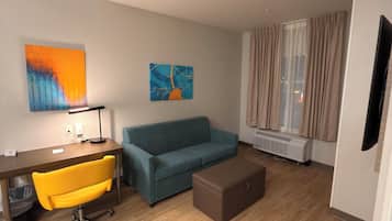 Room, 1 King Bed, Non Smoking (Efficiency) | Living area | 55-inch LED TV with cable channels