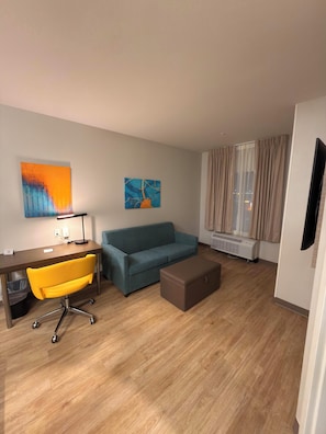 Room, 1 King Bed, Non Smoking (Efficiency) | Living area | 55-inch LED TV with cable channels