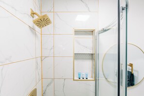 Shower, hair dryer, towels, soap