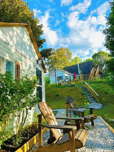 Unique A-frame retreat right on the river and steps to the beach.