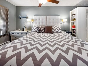 A bedroom with a large bed, a nightstand, a dresser, and a ceiling fan. - Hidden Creek Pond View Perfection Canyons Parkcity (Park City)