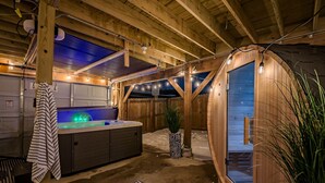 A hot tub in a wooden cabin with a view of the sky. - Modern Group Oasis: Hot Tub, Arcade & Fire Pit (St. Louis)
