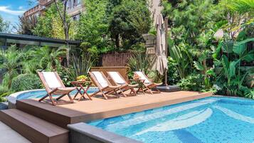 Seasonal outdoor pool, open 10:00 AM to 6:00 PM, pool umbrellas