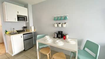 Fridge, microwave, stovetop, coffee/tea maker