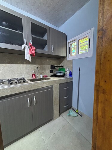 Modern 2-bedroom villa with garden and garage.
