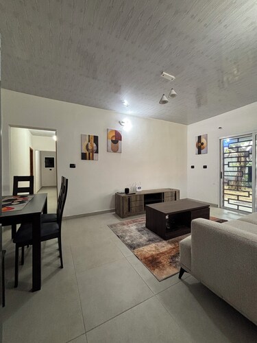 Modern 2-bedroom villa with garden and garage.