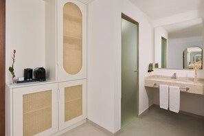 A modern bathroom with a sink, mirror, and cabinets. - Iberostar Selection Montenegro (Bar)