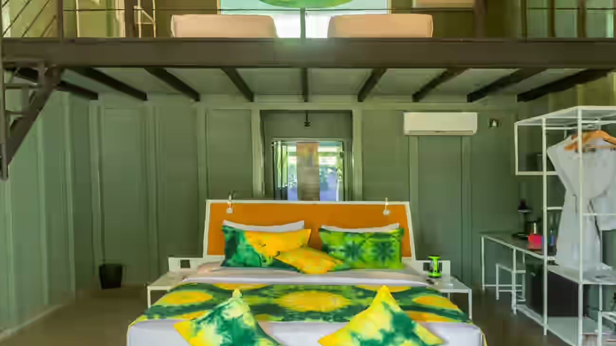 A bedroom with a bed, a wardrobe, and a window.