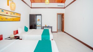 A hotel room with two beds, a desk, a wardrobe, and a ceiling with a wooden panel design. - Adora Bay Ke Ga Beach Resort (Tan Thanh)