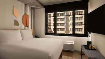 A bedroom with a bed, a window, a radiator, and a small table with bottles.