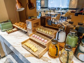 A breakfast buffet with pastries, sandwiches, and beverages. - Mercure Shanghai Pudong Zhangjiang Park (Zhoushan)