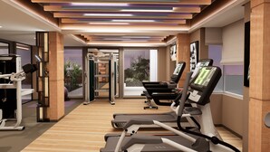 A modern gym with treadmills, weight machines, and a mirror wall. - Vivanta Gurugram, Sector 95A (Gurugram)