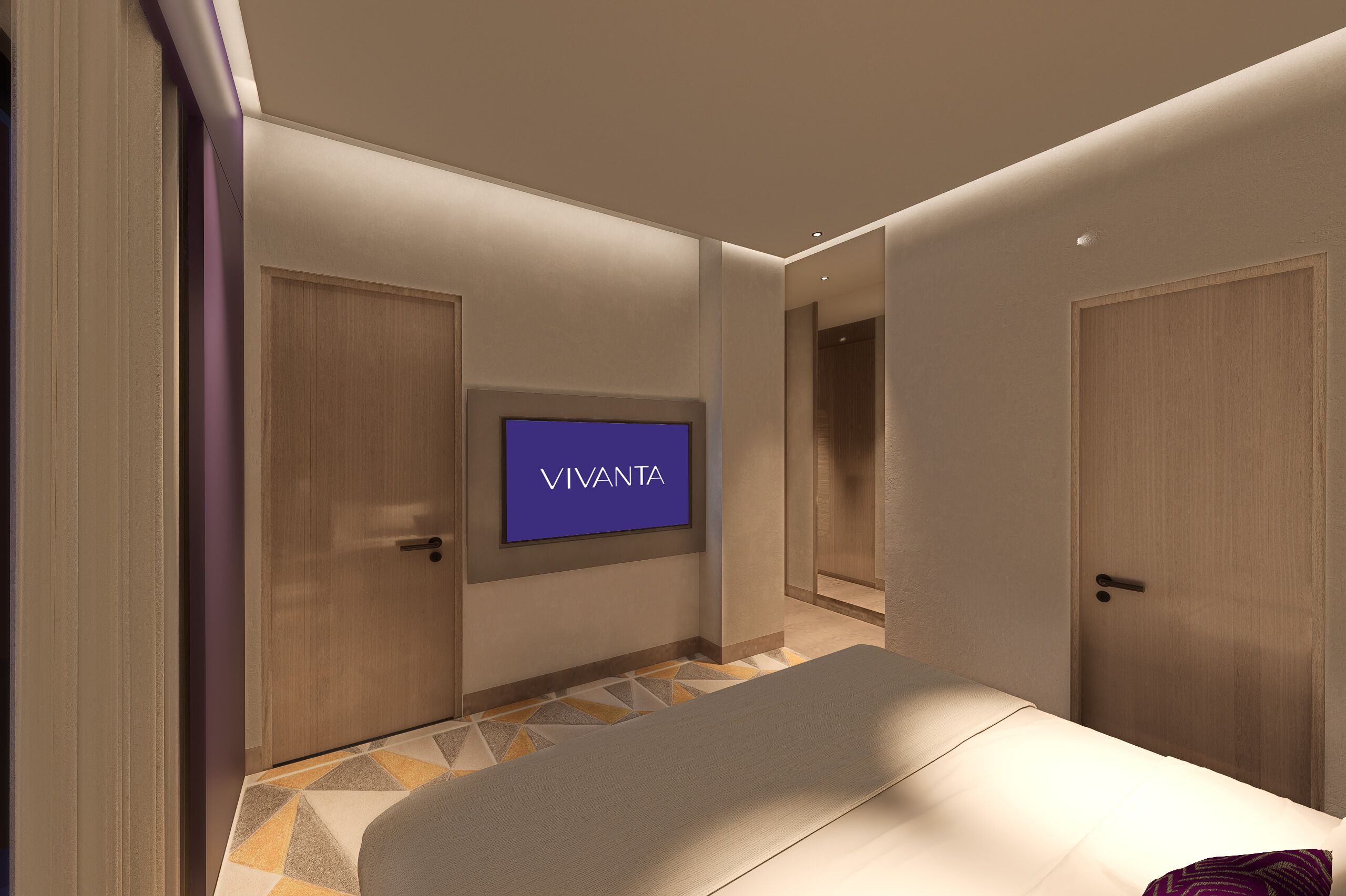 Et moderne hotelværelse med en seng, et fjernsyn ophængt på væggen og en dør til et badeværelse.