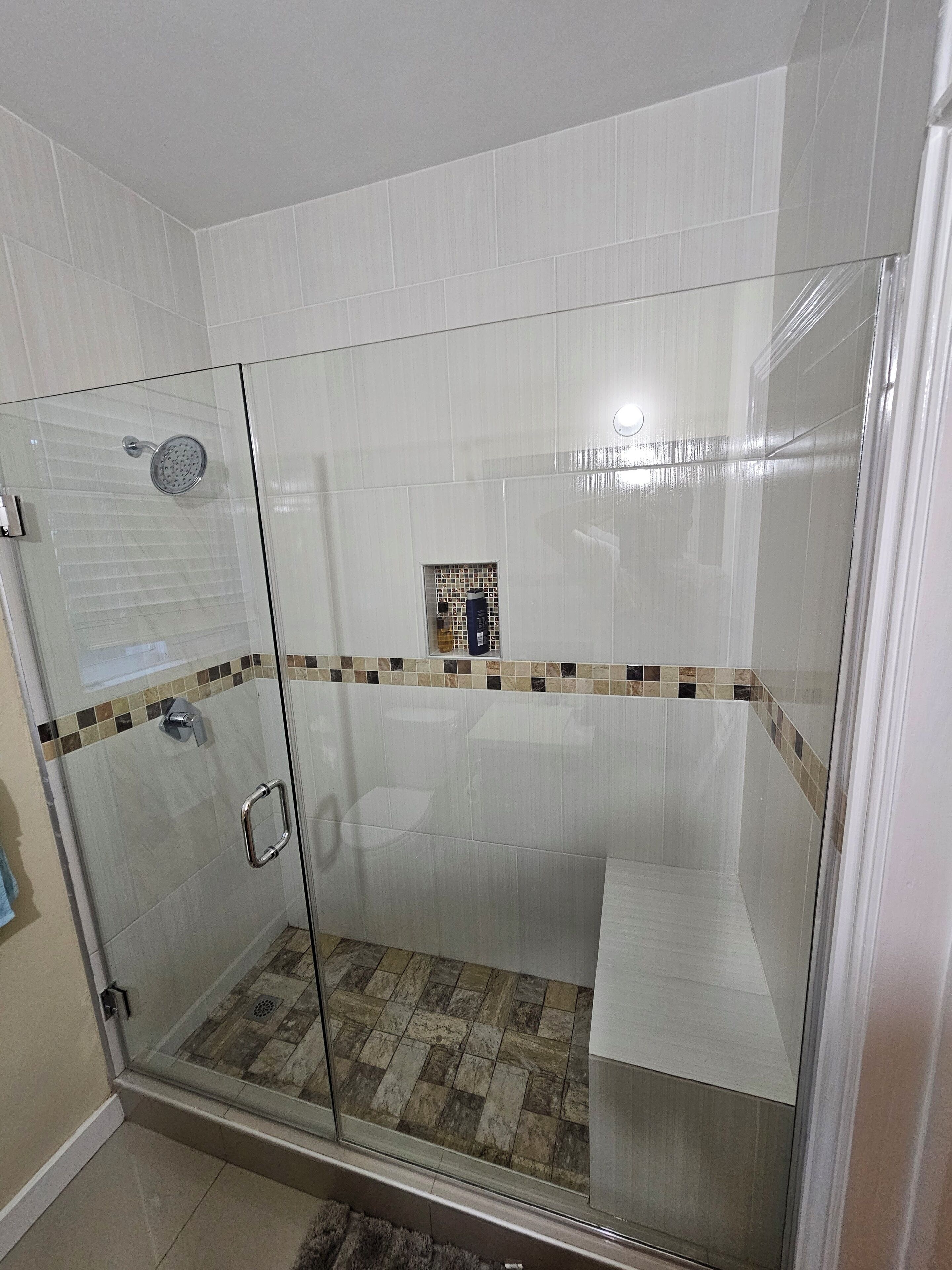 Shower, hair dryer, towels, toilet paper