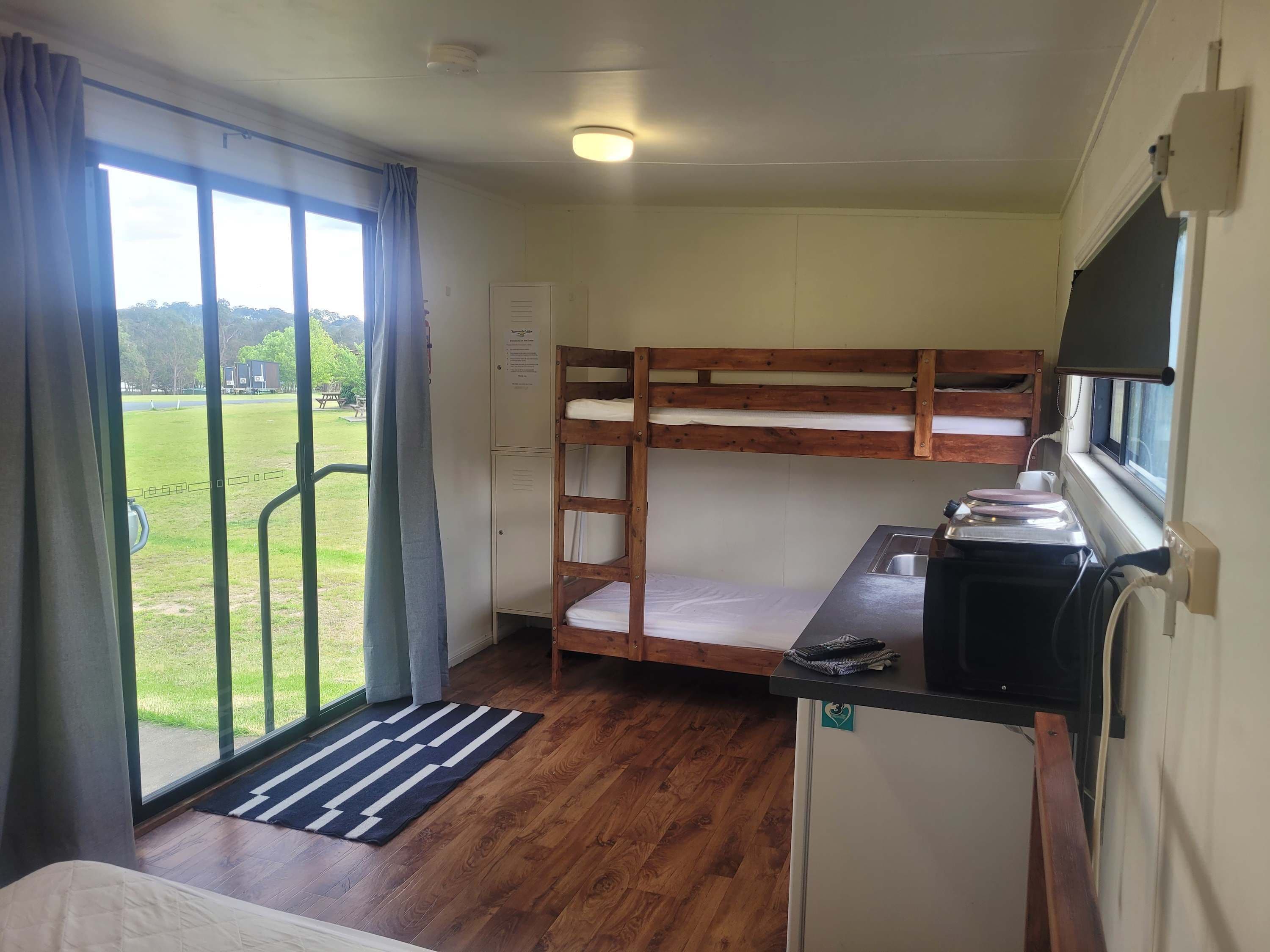 Non-Ensuite Wood Cabin (Bunk and Double Beds) by Tiny Away