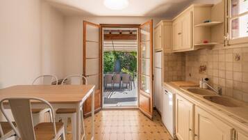 Apartment | Private kitchen | High chair, cleaning supplies