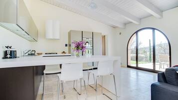 Fridge, coffee/tea maker, highchair, cookware/dishes/utensils