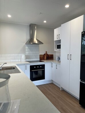 Microwave, oven, stovetop, dishwasher - Village Retreat - location - location (Raumati Beach)
