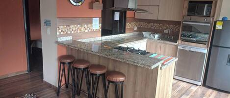 Fridge, microwave, stovetop, coffee/tea maker