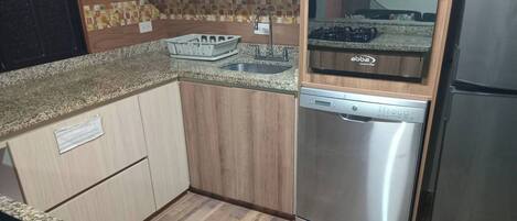 Fridge, microwave, stovetop, coffee/tea maker